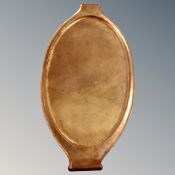 An Arts and Crafts oval copper tray,