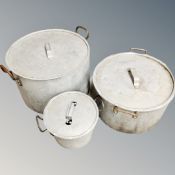 Three aluminium graduated cooking pots with lids