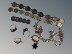 Ten pieces of silver jewellery to include cameo brooches, silver dress rings, coin bracelets,
