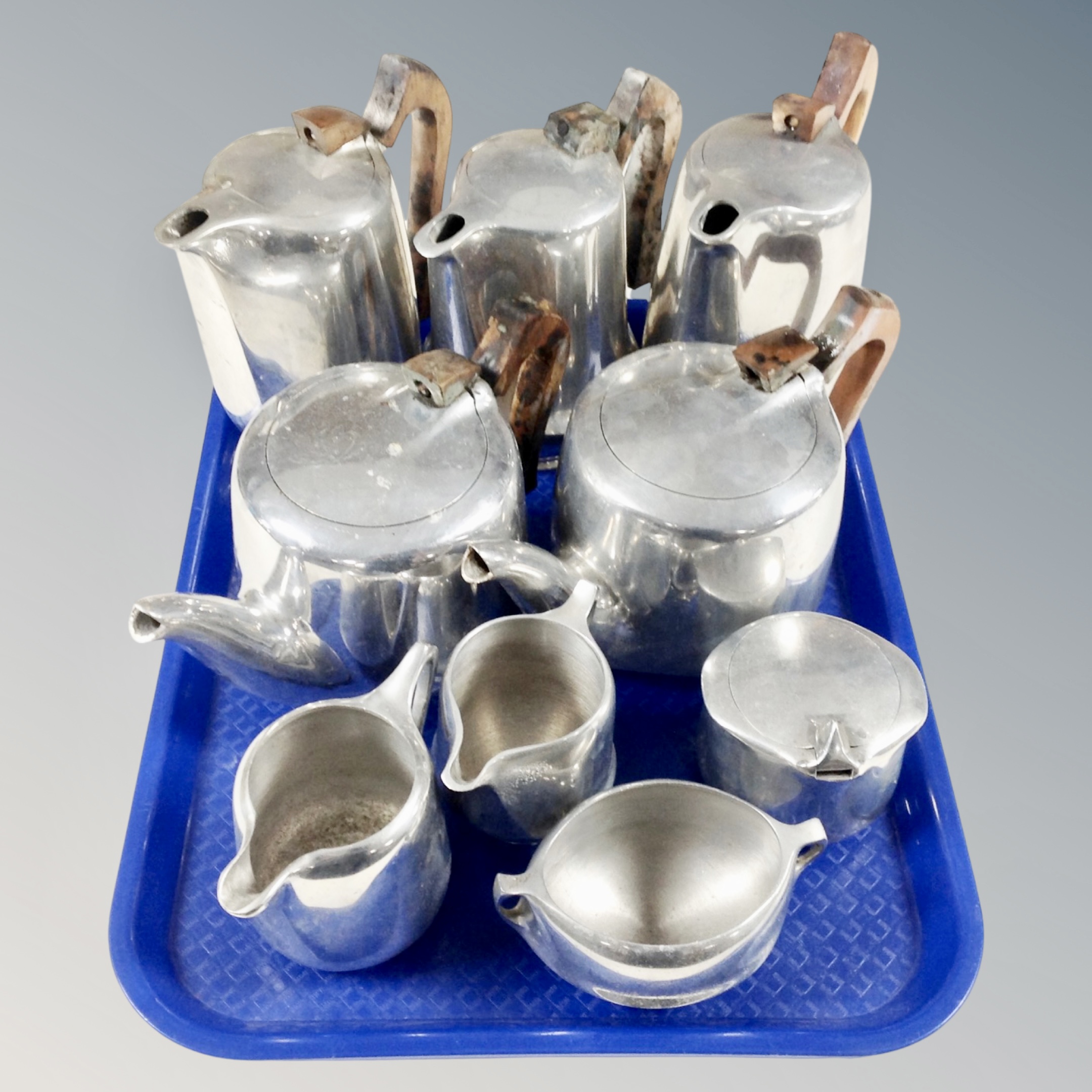A tray of nine pieces of picquot tea ware