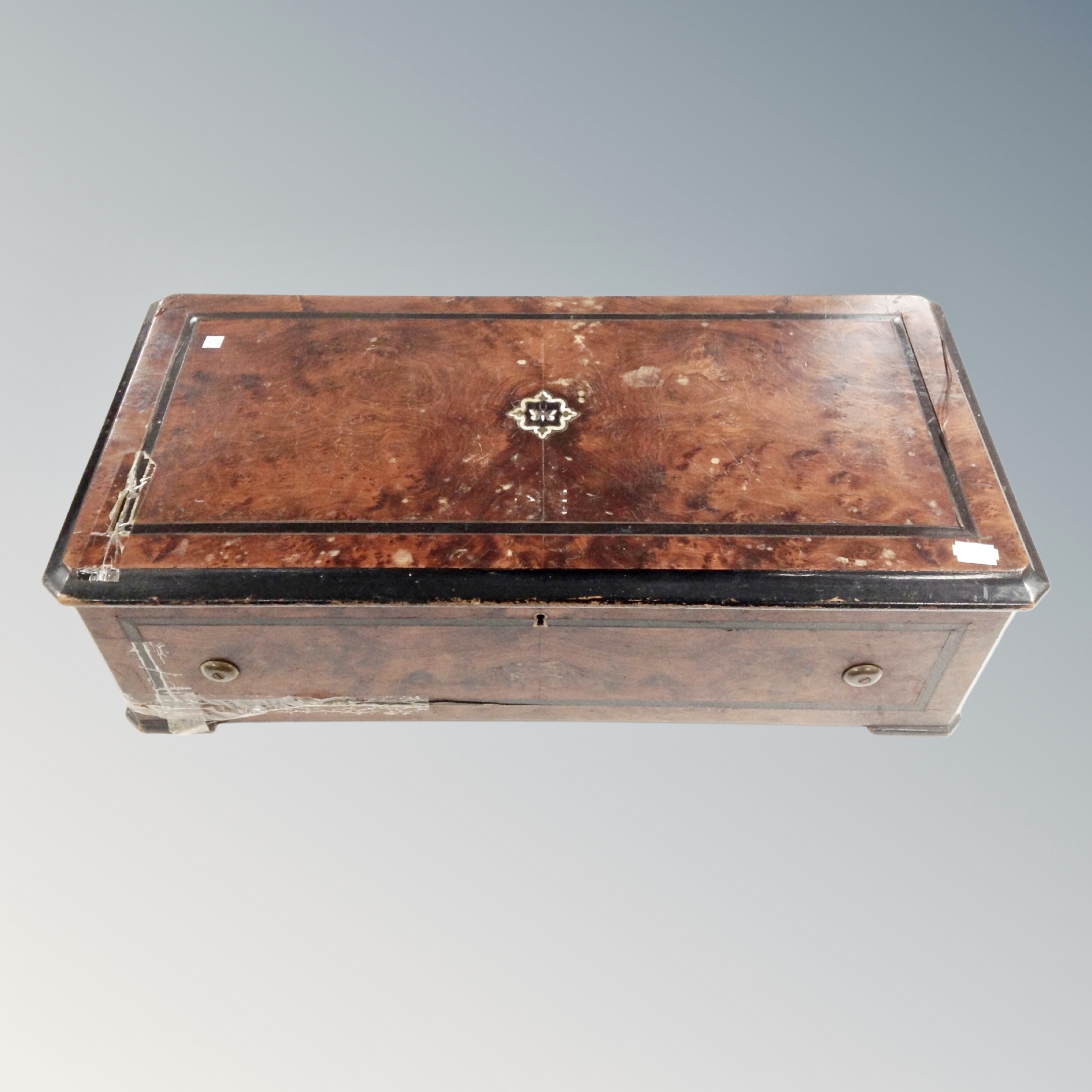 A 19th century inlaid walnut table top Swiss music box