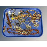 A good collection of costume jewellery, bakelite necklace, amber style cuff bracelet,