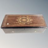 A 19th century inlaid rosewood table top Swiss music box