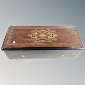 A 19th century inlaid rosewood table top Swiss music box