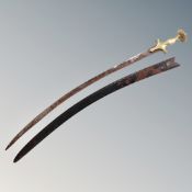 A brass handled Indian Talwar in scabbard