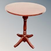 A circular pedestal pub table