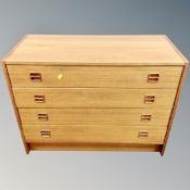 A 20th century teak four drawer chest