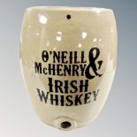 A stoneware barrel bearing O'neil and Mchenry Irish whisky advertising,