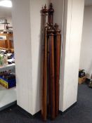 Eight antique and later curtain poles and rings.
