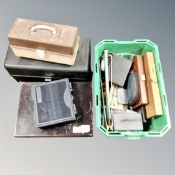 A collection of fly boxes, two tackle boxes,