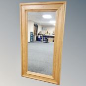 A contemporary oak full length mirror,
