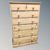 A Victorian style pine seven drawer chest