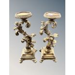 A pair of gilt gesso candlesticks