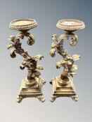 A pair of gilt gesso candlesticks