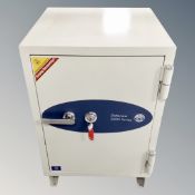 A Data Care 200 series fire safe with keys,