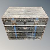 An antique metal bound shipping trunk