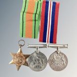 Three WW II medals on two ribbons.