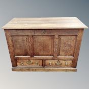 A 19th century oak coffer fitted with two drawers