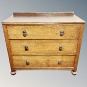 A 1930's oak three drawer chest