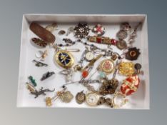 A vintage and later collection of costume jewellery, ornate brooches, sports medals, perfume bottle,