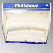 A Philishaver branded counter top display cabinet with key