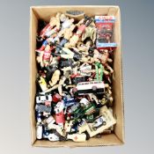 A box of wrestling figures and die-cast vehicles