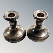 A pair of squat silver candlesticks, height 19.5 cm. CONDITION REPORT: Weighted.