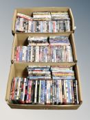 Three boxes containing approximately 150 dvds