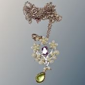 A pearl and peridot pendant chain