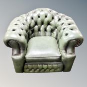 A Chesterfield buttoned tub armchair in green leather