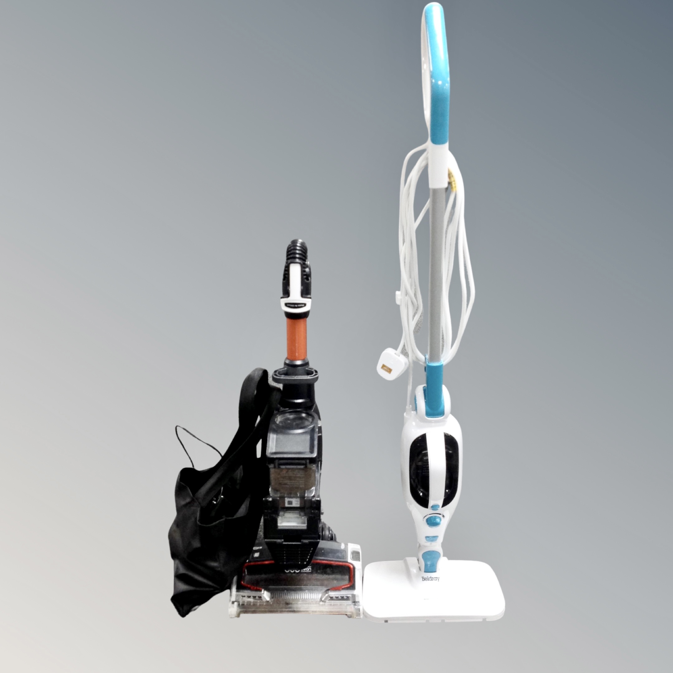 A Shark duo clean folding vac with accessories together with a Beldray steam floor cleaner