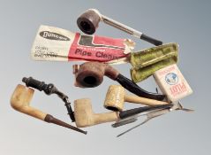 A group of vintage pipes and other smoking ephemera
