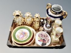 A box containing collectors plates, gilt pineapple ornaments, other ceramics.
