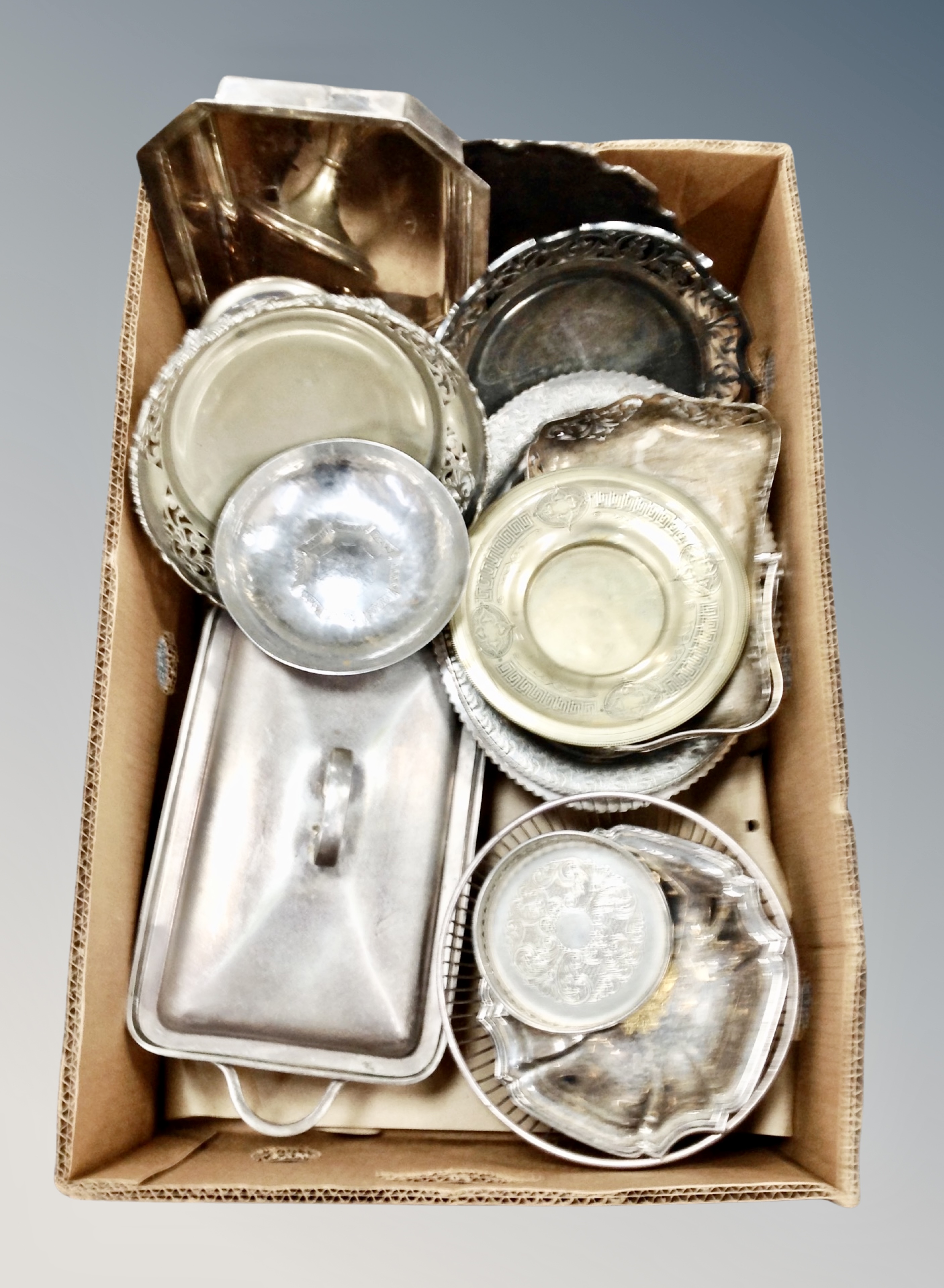 A box of plated wares including serving dishes, lidded muffin dish, bottle coaster,