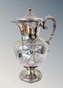 A silver plated claret jug decorated in Regency swags