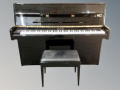 A Hohner HP-110 overstrung upright piano, made in Korea, in high gloss ebonised case, width 145 cm,