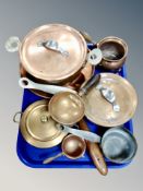 A tray of copper wares including wooden handles pots and pans, lidded serving bowls etc.