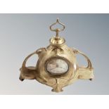 A brass Art Nouveau mantel clock, width 35 cm.