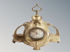 A brass Art Nouveau mantel clock, width 35 cm.