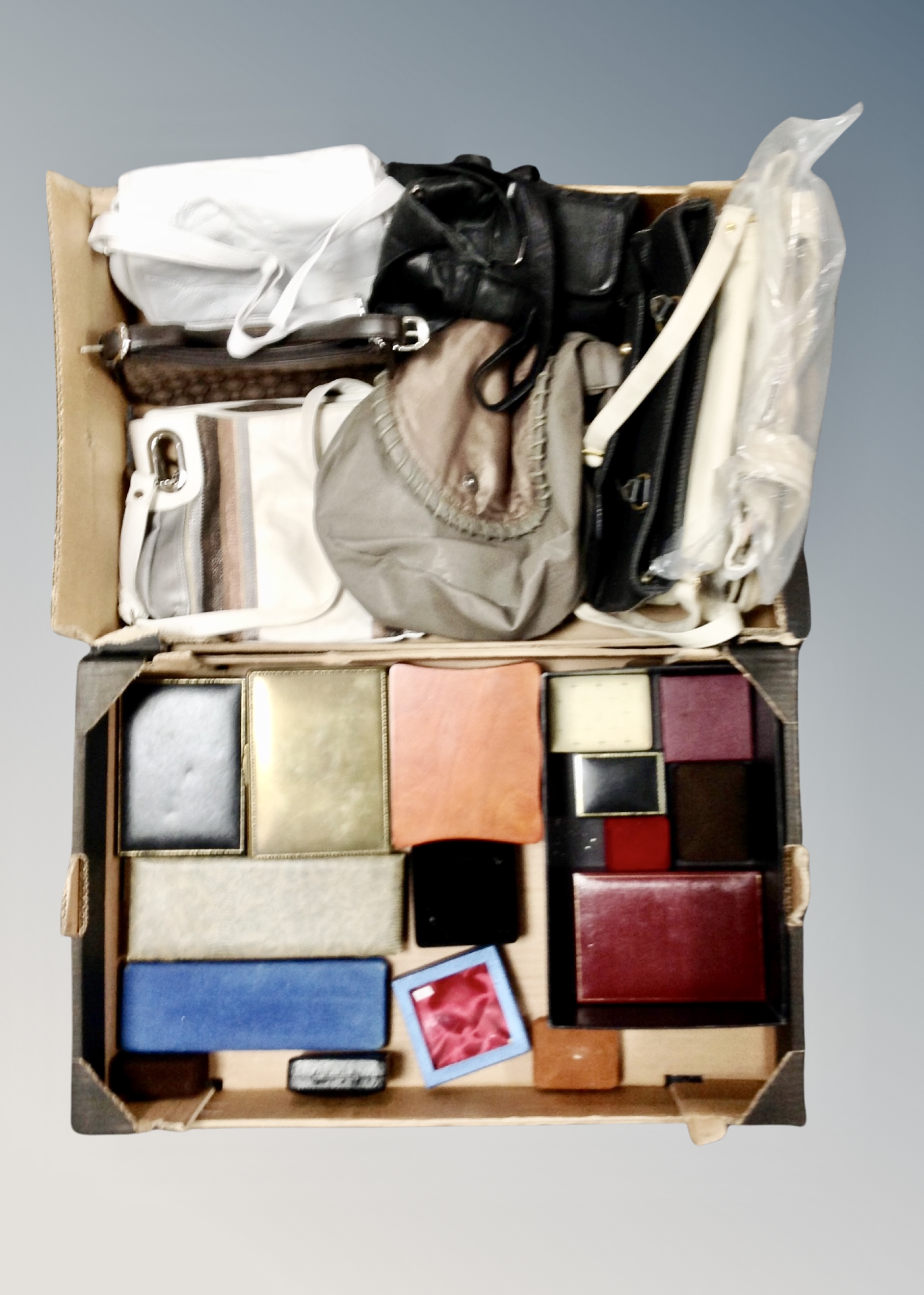 Two boxes containing assorted jewelry boxes, ladies handbags.