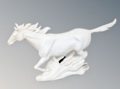 A contemporary figure of a white horse,