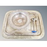 Two silver plated serving trays together with a pedestal bowl, weighted trumpet vase,