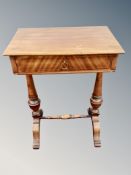 A Continental mahogany work table and contents,