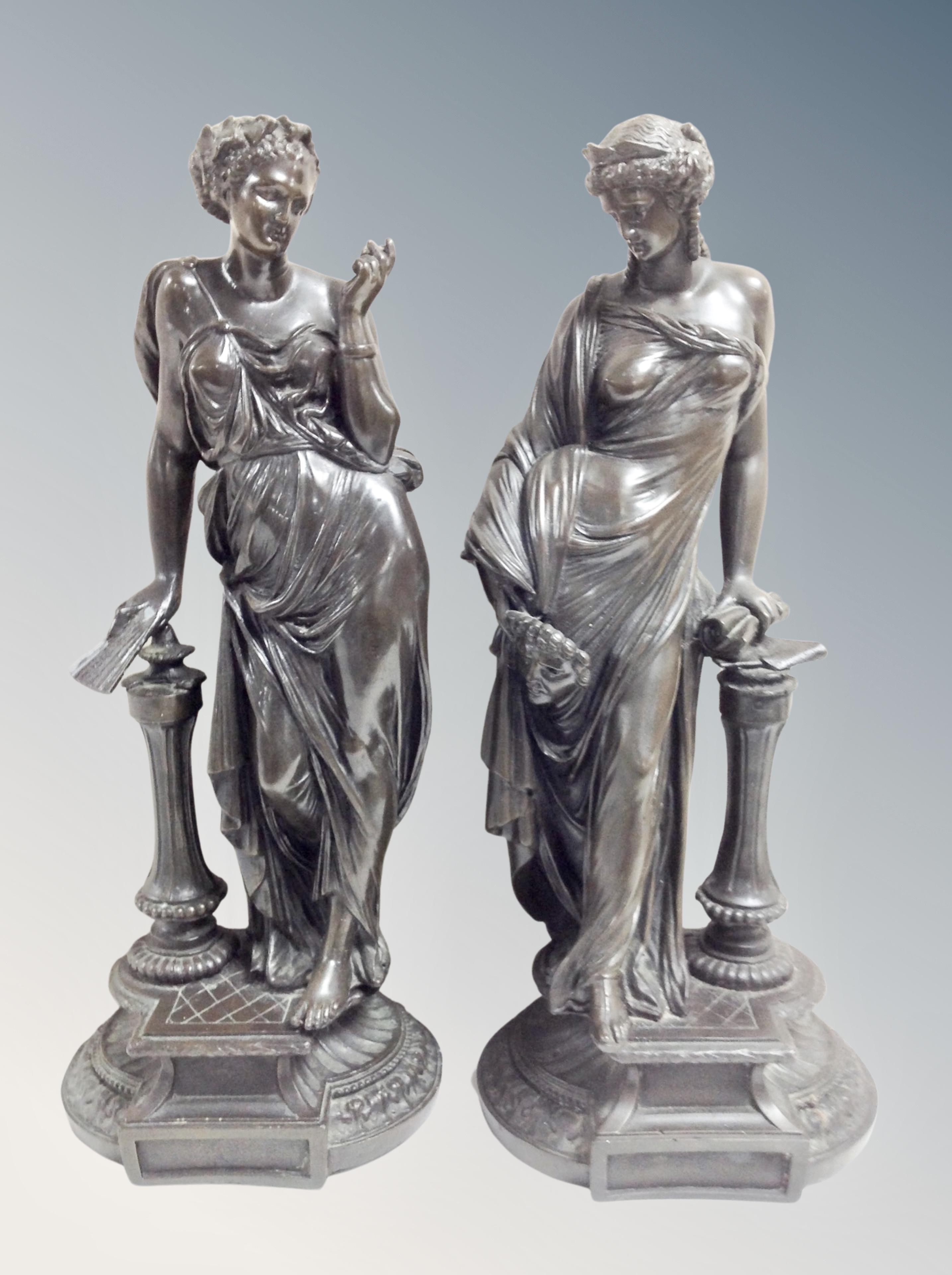 A pair of resin classical style figures,