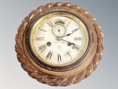 An oak ships clock, diameter 24 cm.