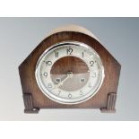 An Art Deco oak eight day mantel clock.