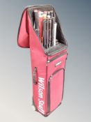 A Wilson Staff Custom Fit golf bag containing golf club shaft samples