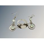 A silver moonstone ring and pair of earrings