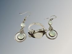 A silver moonstone ring and pair of earrings