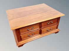 An eastern hardwood coffee table/chest fitted eight drawers,